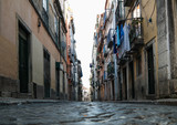 Fototapeta Uliczki - low angle shot of narrow alley in Lisbon, Portugal