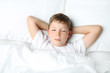 © 5second - Young boy sleeping in white bed
