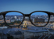 Clear vision through glasses over night city landscape