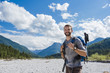 © Westend61 - Germany, Bavaria, portrait of young hiker with backpack and hiking poles