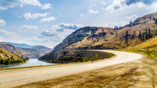 The Trans Canada Highway Winding Through The Mountains And Along The Thompson River Between The Towns Of Cache Creek And Spences Bridge In Central British Columbia