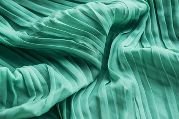 The texture of the mint pleated fabric. Green georgette fabrics.