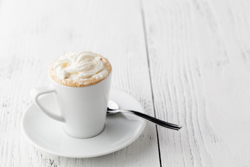 Coffee cocktail with caramel in cup