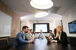 © NDABCREATIVITY - Perspective businesspeople having meeting in conference room