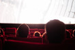 © Boris Jovanovic/Stocksy - People watching a movie in cinema
