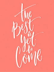 Wall Mural - The best is yet to come. Inspirational positive quote, brush calligraphy on pink background.