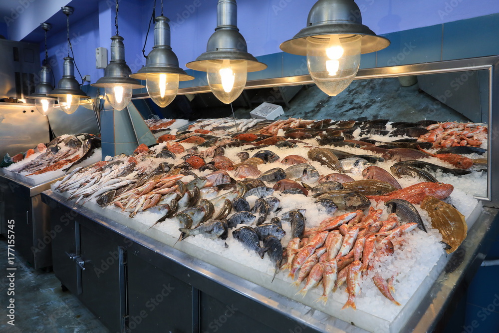 Variety of sea fishes on the counter in a greek fish shop. Stock Photo ...