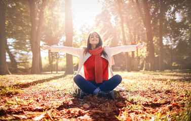 Girl enjoying autumn time in a park