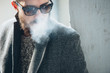 © Nemanja Glumac/Stocksy - Cool Man With Beard Covered in Smoke