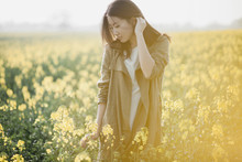 Asian Girl On The Yellow Field