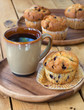Blueberry Muffin and Coffee on a Wooden Plate