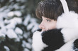 © Alexey Kuzma/Stocksy - winter close-up of the young woman with the white warm fur .