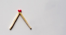 Red-tipped Matches Arranged To Make A Heart Shape.