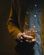 © CWP, LLC/Stocksy - Young man drinking whiskey