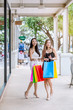 © Anucha - Two Beautiful Asian women are shopping happily during the daytime.