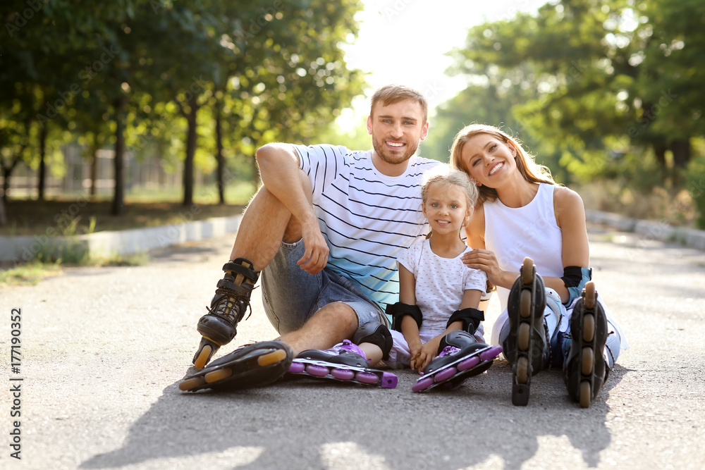 Family with roller skates in park