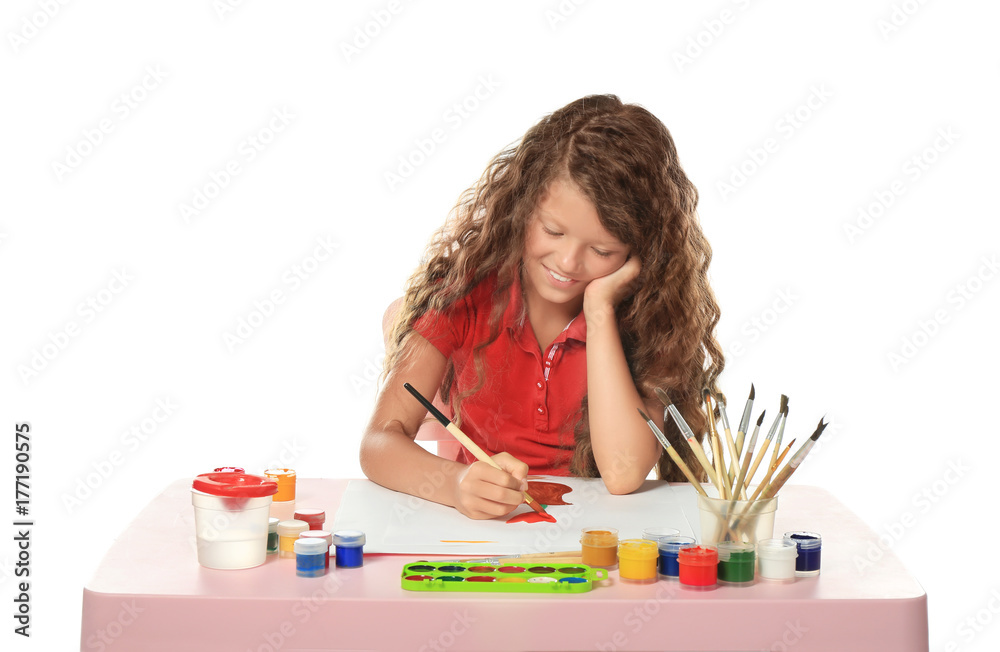 Little cute girl painting at table on white background
