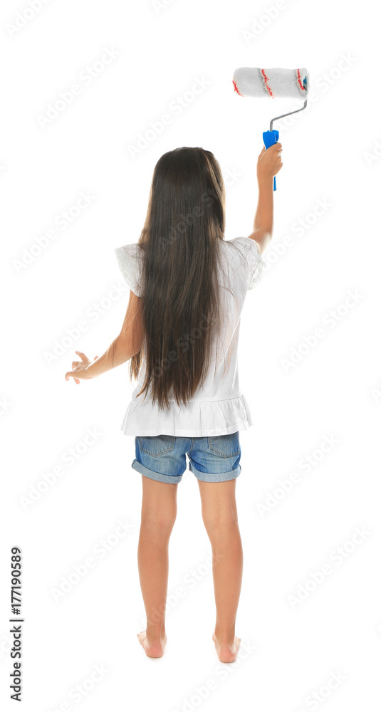 Little cute girl with paint roller on white background