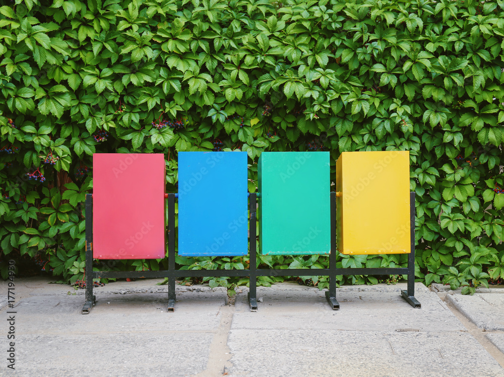 Recycling bins for different types of garbage outdoors
