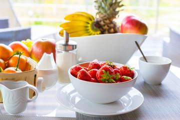 Wall Mural - Strawberries in a white dish. Breakfast from fruit.