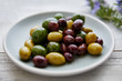 © trinettereed/Stocksy - Still life of fresh olives on plate