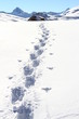 FOOT PRINT IN SNOW COVERED MOUNTAIN LANDSCAPE