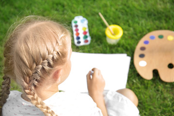 Wall Mural - Cute little girl painting picture, outdoors