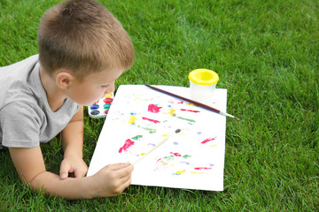 Poster - Cute little boy painting picture, outdoors