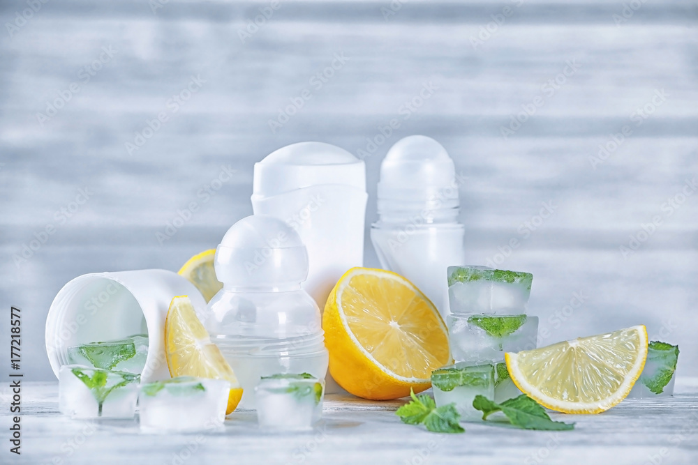 Deodorants for women, lemons and mint on table