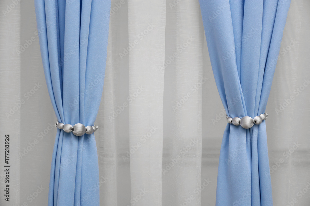 Beautiful curtains with tiebacks indoors