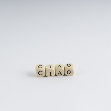 formation of the word Ciao with nuts containing the letters