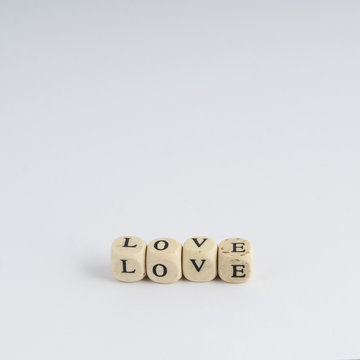 formation of the word Love with nuts containing the letters