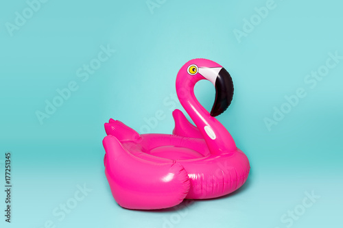Fotografía Pink, trendy, blown beach flamingo on a blue background