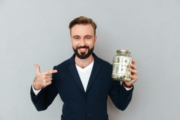 Sticker - happy confident man pointing at box with money isolated