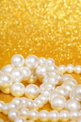 Wall Mural - Pile of pearls on golden christmas background