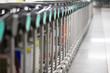 © saras2stock - Row of luggage carts at the airport for transporting luggage.