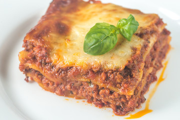 Canvas Print - Portion of lasagne on the wooden table