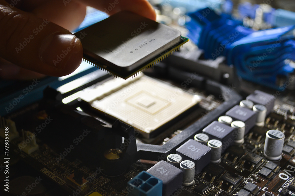 Installing the CPU into the motherboard Stock Photo | Adobe Stock