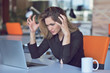 © FS-Stock - Frustrated angry woman screaming on her laptop.