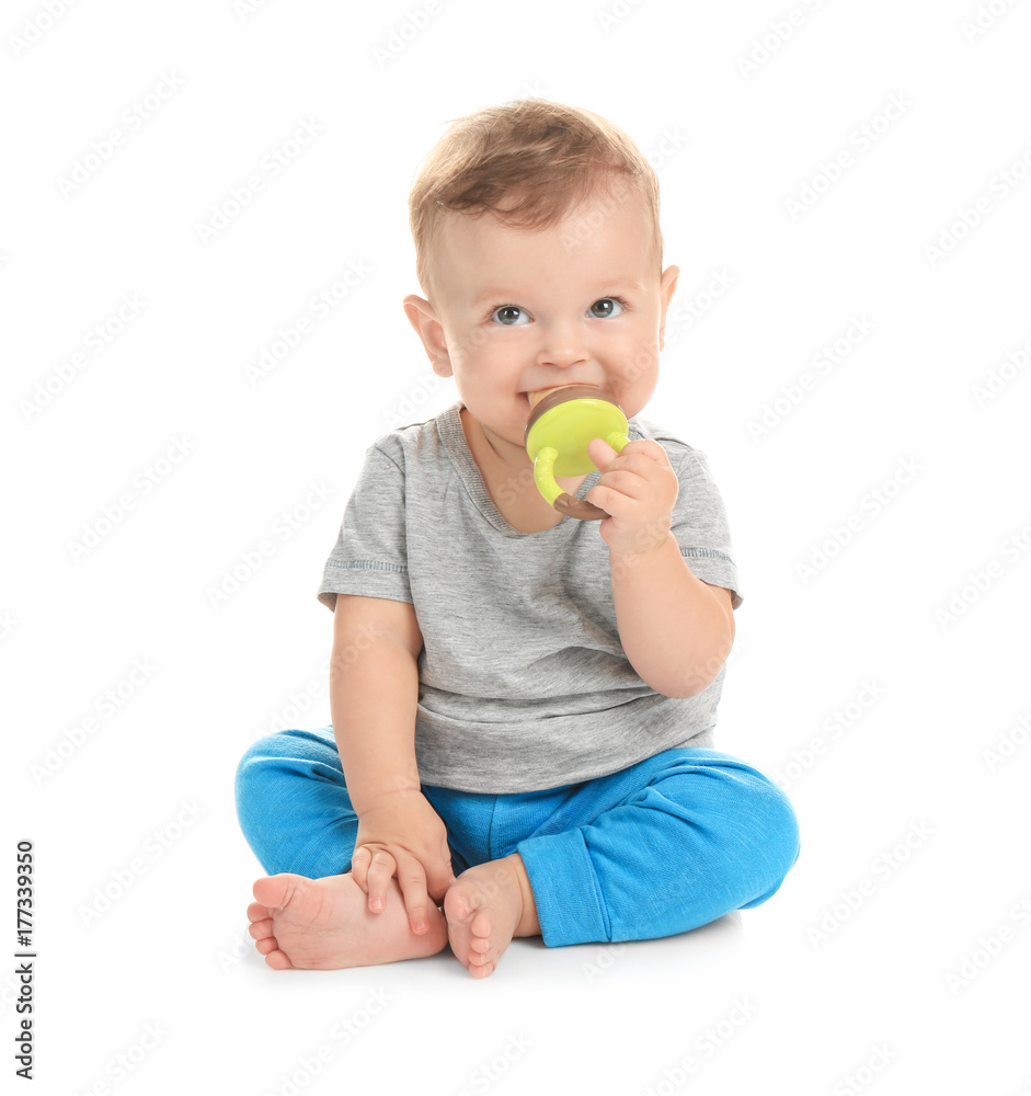 Adorable little baby with nibbler on white background