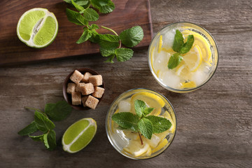 Wall Mural - Composition with fresh mojito cocktail on wooden background