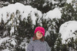 © goodnessgrace/Stocksy - Smiling girl with bright pink hat plays in snow