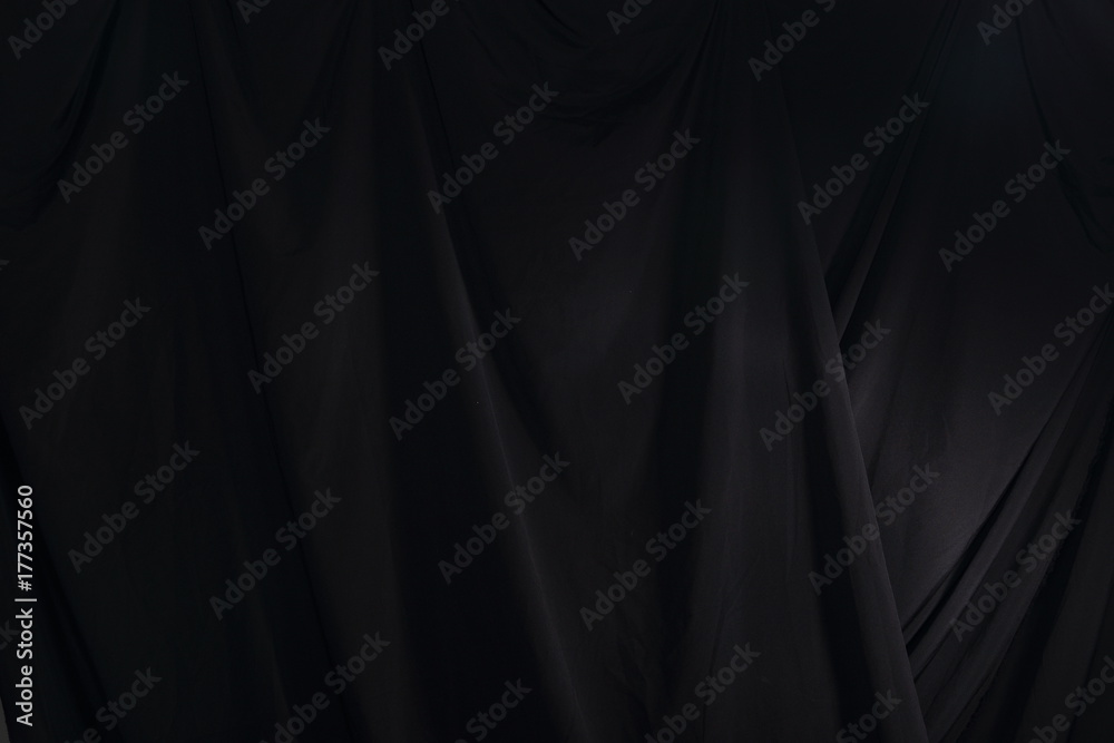 Black Curtain drape wave with studio lighting