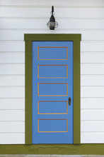 Old Blue And Orange Wooden Door With Olive Green Trim