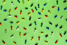 Colorful Pins On Green Background