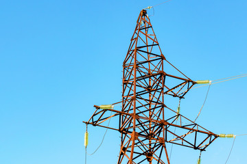 Transmission line tower on blue sky