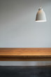 © Miquel Llonch/Stocksy - Interior decoration with wooden table and hanging lamp