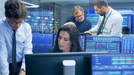 Aufkleber - Multi-Ethnic Team of Stock Traders at the Stock Exchange Firm Office is Busy Selling and Buying Bonds and Shares. Displays Show Relevant Graphs and Numbers.