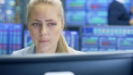 Poster - Experienced Stock Exchange Trader Making Sales and Buys at Her Workstation. Multi-Ethnic Team at Stock Exchange Office is Busy Selling and Buying Stocks on the Market. 