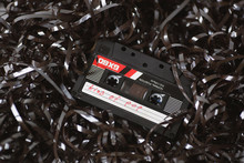 Old Audio Cassette On A Bed Of Loose Tape